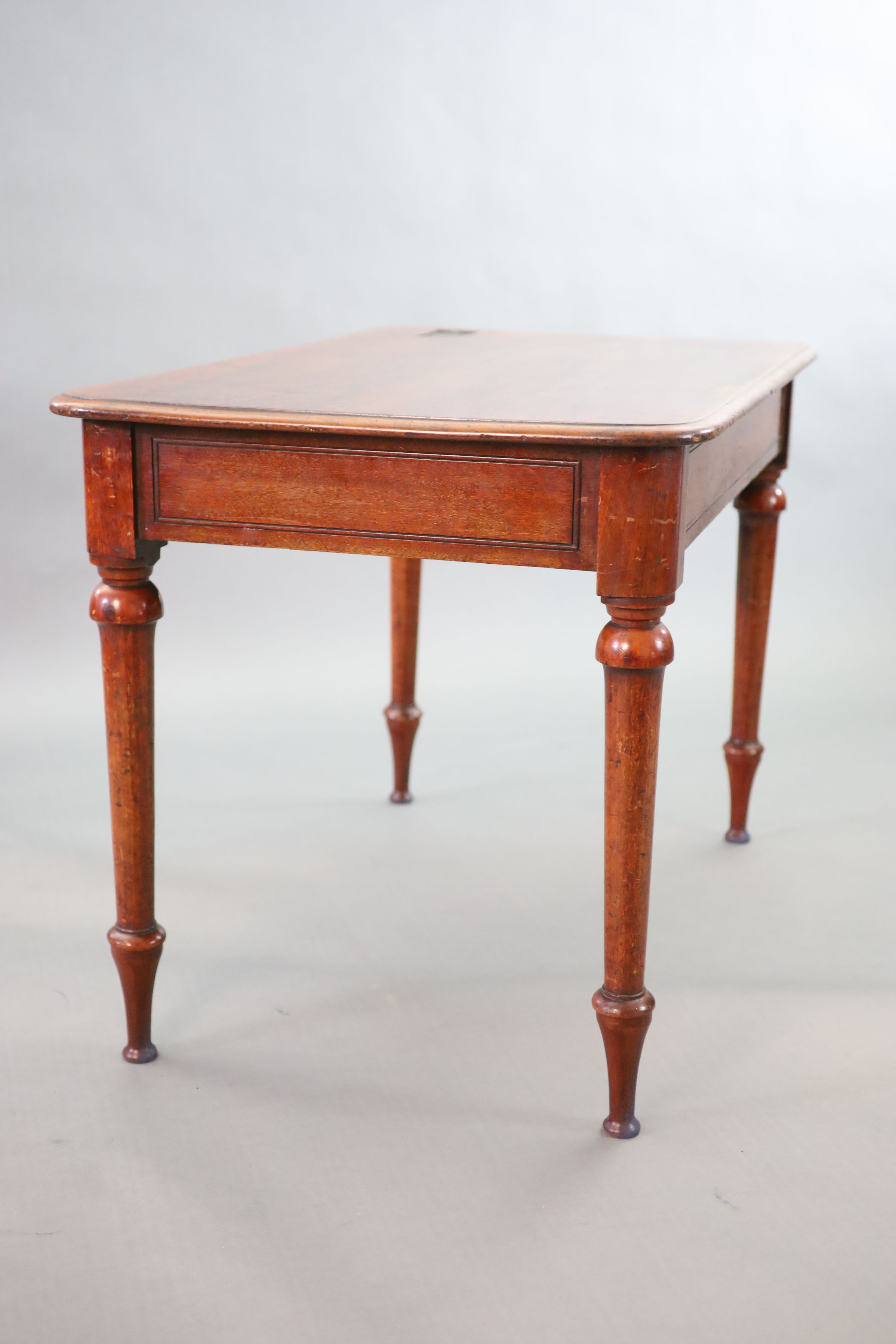 A Victorian mahogany writing table, W.114cm, D.69cm H.76cm